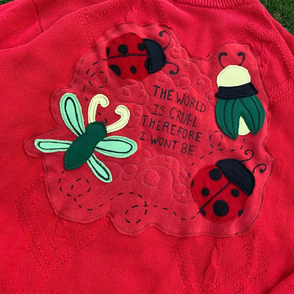 Custom Upcycled Red Bug Patchwork Sweater “The World Is Cruel” Oversized M